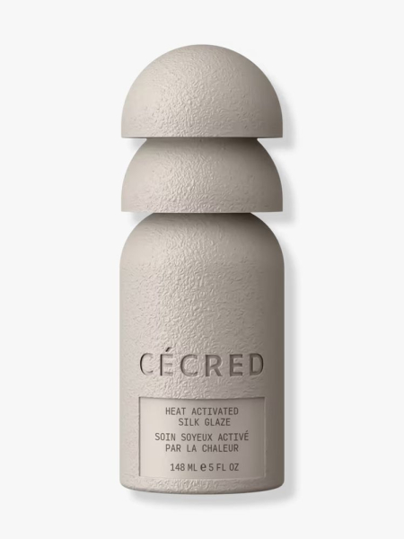 Cécred Heat Activated Silk Glaze greige bottle with stacked half spheres cap on light gray background